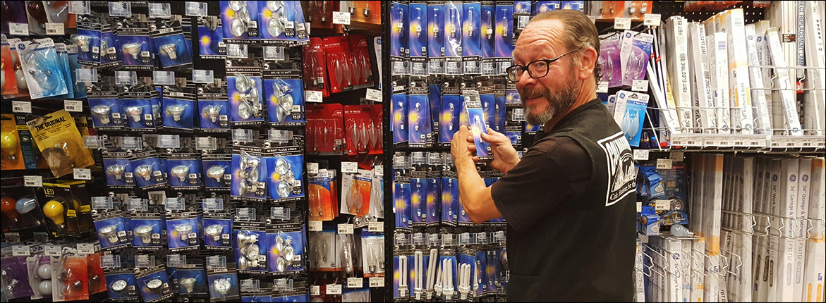 Cole Hardware Employee Stocking Electrical Supplies